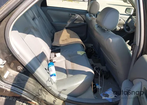 2000 Toyota Camry Le from USA, damaged, VIN JT2BG22K1Y0433460